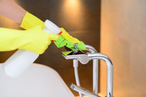 Local cleaner working in a SW16 flat hallway